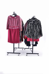 Variety of evening gown clothing, coat,  jacket  on hanging