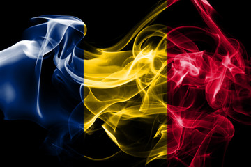 Fototapeta na wymiar National flag of Chad made from colored smoke isolated on black background