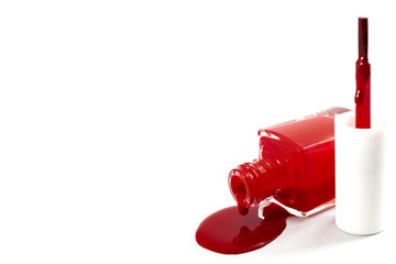 Women beauty products, luxury fashion and makeup concept with close up on a dropped bottle of red...