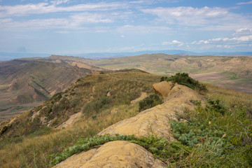 Fototapeta na wymiar day scene, mount slope, valley. Steppe landscape, top view Georgia the Caucasus