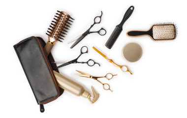 Essential hair dresser tools with leather bag on white background