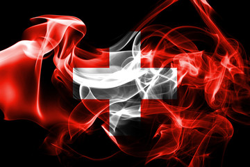 National flag of Switzerland made from colored smoke isolated on black background