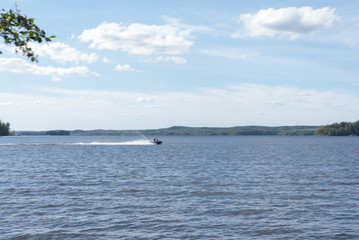 Obraz premium Motion blur, woman driving water scooter