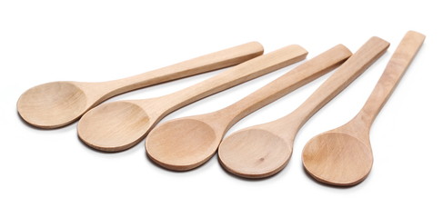 Empty wooden spoons isolated on white background
