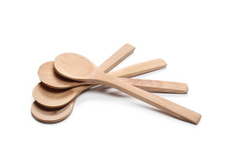 Empty wooden spoons isolated on white background