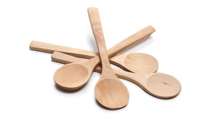 Empty wooden spoons isolated on white background