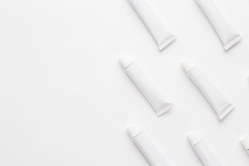 oil paint tubes on white background. not isolated with copy space