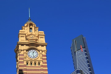 Fototapeta na wymiar New and old composition of Eureka tower and Flinders station Melbourne Australia