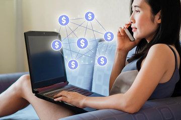 Asia woman using laptop for checking social media and success of business.Marketing and social media concept .