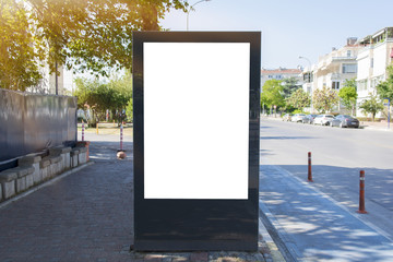 Blank white mock up of vertical light box billboard at bus stop station