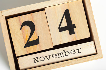 Wooden cubes with date on white background. 24th of November