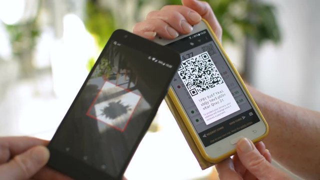 Man and woman exchaning funds through peer-to-peer digital cryptocurrency Bitcoin, digital cash transaction concept