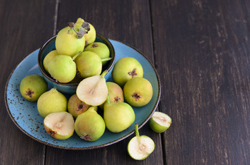 Group of Fresh organic pears and half pear on wooden background. . Seasonal fruit. Concept for healthy food or raw diet.Copy space