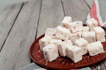 Turkish delight on a wooden table.