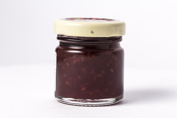 Jam jar isolated on white background