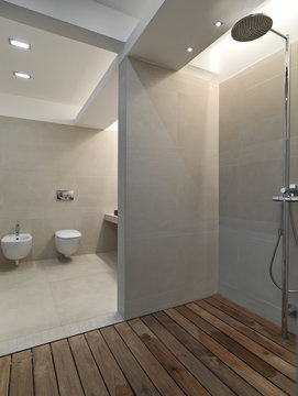 interiors shots of a modern bathroom in the foreground the shower cubicle