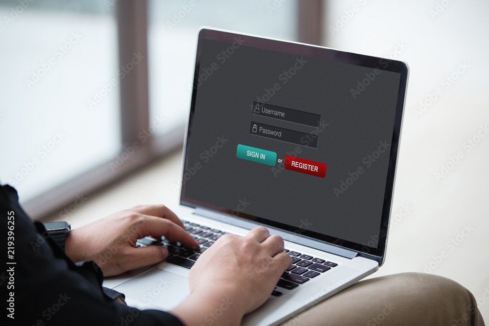 Poster man working and sign in membership username password on laptop / computer at office