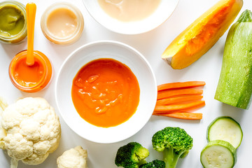cooking vegetable puree for baby on white background top view