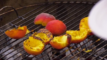 Peaches on the grill, summer cooking. Cooking peaches on the grill