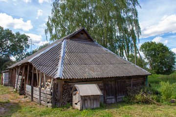 Old outbuildings and an abandoned dog house