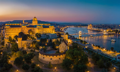 Fototapeta na wymiar Budapest Hungary - Aerial panoramic skyline view of Budapest at blue hour with Buda Castle Royal Palace, Szechenyi Chain Bridge, Parliament and sightseeing boats on River Danube