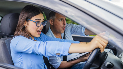 Woman Driver - Car Accident, yells in fear or frustration. Student girl sitting scared in a car. incident happens. Car Crash Accident with a Scared Driver and a instructor