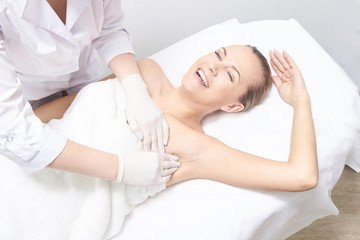 Fototapeta na wymiar Waxing woman leg. Sugar hair removal. laser service epilation. Salon wax beautician procedure