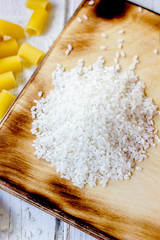 Kitchen board with a dry raw rice