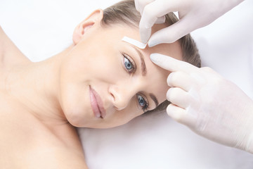 Waxing woman body. Sugar hair removal. laser service epilation. Salon wax beautician procedure