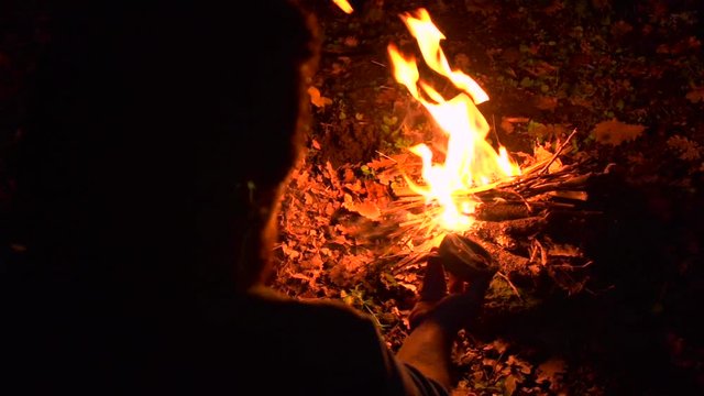 Mushroom fuse (fomes fomentarius) in a little clay bowl near a new fire