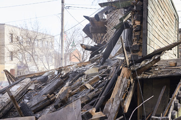 Demolition house using excavator in city. Rebuilding process. Remove equipment