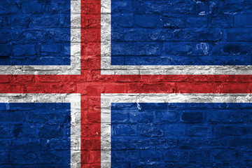 Flag of Iceland over an old brick wall background, surface