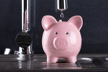 Water Droplet Falling In Piggybank