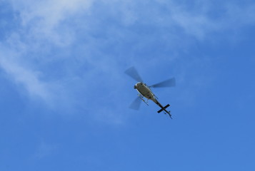 Helicopter in blue sky