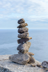 stones on the shore built up by a pyramid