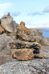 stones on the shore built up by a pyramid