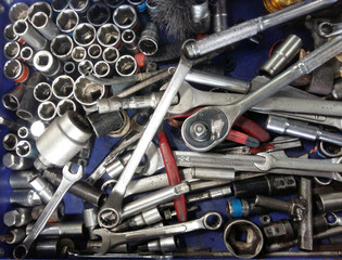 Dirty set of hand bunch of messy tools in the garage on a vintage background