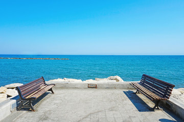 Two benches on the sea promenade
