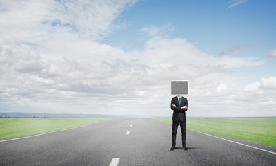 Businessman with monitor instead of head.