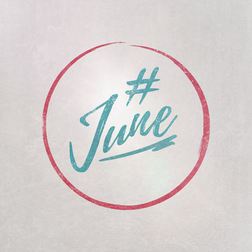# Hashtag June written on textured grey background