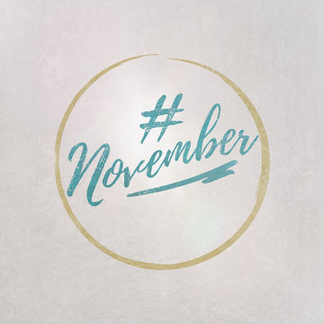 # Hashtag November written on textured grey background