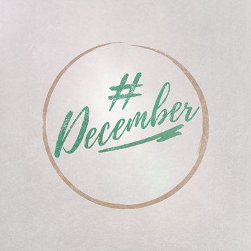 # Hashtag December written on textured grey background