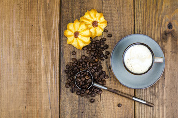 Obraz na płótnie Canvas Coffee in cup, biscuits, beans