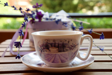 Tea in the garden, white teacup with purple pattern