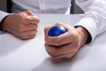 Businessman Pressing Stress Ball