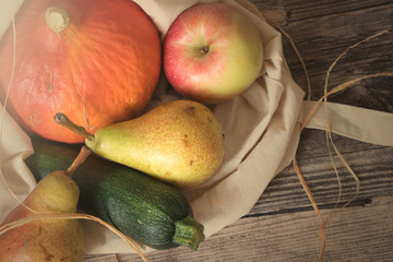autumn fruits and vegetable with cotton bag from top