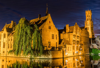 Naklejka premium Reflections in canal in Bruges, Belgium during the night