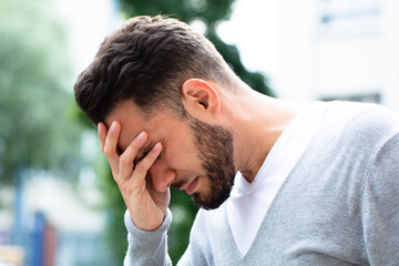 Man Suffering From Headache