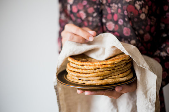 Woman holding Traditional Indian bread - Aloo paratha or aalu parotha, potato stuffed bread