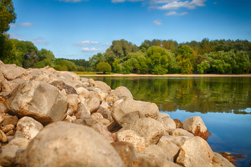 Beautiful summer landscape with a lake, trees and blue sky
